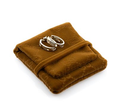 18K Gold Gucci Earrings. 18K white gold hinged hoop earrings for pierced ears. Gucci G logo 