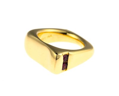 18K Gold and Ruby Ring. A size 5.25 yellow gold ring enhanced by two round brilliant cut red 