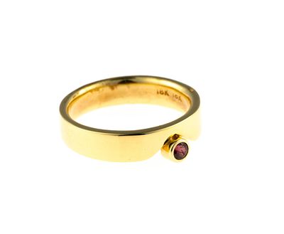 18K Gold and Ruby Ring. A size 6.25 yellow gold ring with a round cut ruby approximately 0.11 