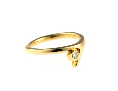 18K Gold and Diamond Ring. A size 6.25 yellow gold ring enhanced by a round brilliant cut 