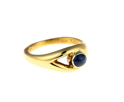 18K Gold and Sapphire Ring. A size 6.25 yellow gold ring enhanced by a round cabochon blue 