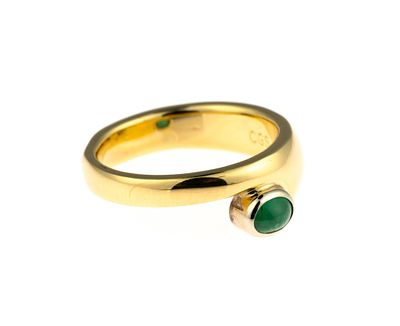 18K Gold and Emerald Ring. A size 6 yellow gold ring enhanced by a .29 carat oval cabochon green 