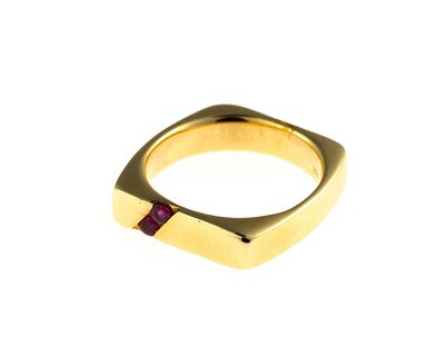 18K Gold and Ruby Ring. A size 9.25 yellow gold ring enhanced by two round brilliant cut rubies. 