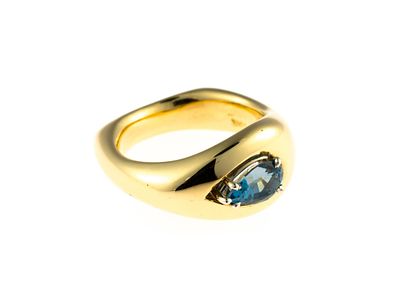 18K Gold and Blue Topaz Ring. A size 6 yellow gold ring enhanced by a pear shaped 1.2 carat blue 