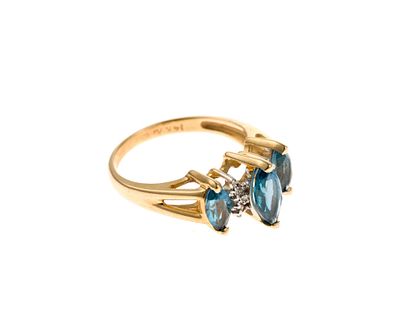 14K Gold Gemstone Ring. A size 5 ring in yellow gold, marked 14k, with marquise topaz accented 