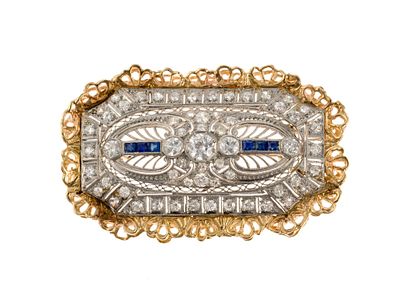 Platinum Gold 2.3 CTW Diamond Brooch. 2" length platinum brooch bordered by 14k yellow gold and 