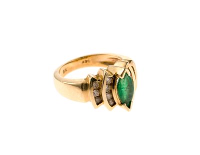 14K Gold Emerald Diamond Ring. A size 4.5 ring in yellow gold, marked 14k, with a central 