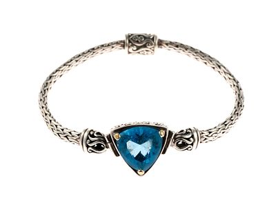 Sterling Silver London Blue Topaz Bracelet. A 7" sterling bracelet with braided chain and a 