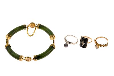 Three 10K Gold Rings and Jade Bracelet. One size 4 onyx ring testing 10k, one size 5 CZ ring 