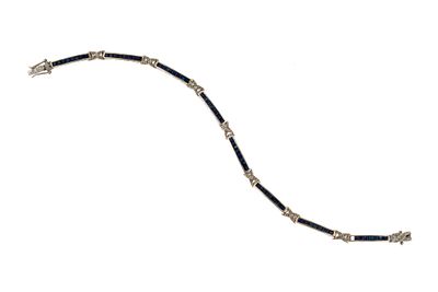 10K Gold, Sapphire and Diamond Bracelet. A 7" white gold bracelet marked 10k with blue sapphires 