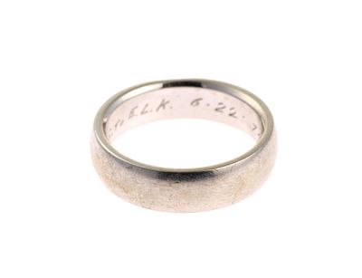 18K Gold Band Ring. A size five white gold band ring in 18k. The ring weighs 6.5 grams.