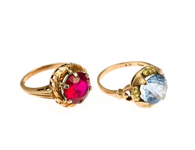 Two 10K Gold Gemstone Rings. A size 5.5 ring with red gemstone and a size 7 ring with blue 