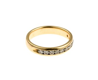 14K Gold and Diamond Band Ring. A size 6 ring with eleven channel-set round diamonds. The ring 