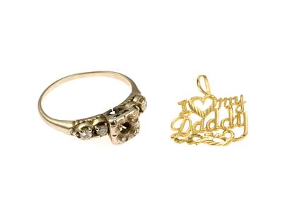 Scrap Gold Jewelry. A white gold ring with four diamonds testing 14k gold and a gold pendant 
