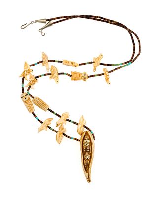 Vintage Zuni Fetish Necklace. Heishi bead necklace with fetishes. The necklace is 31" length 