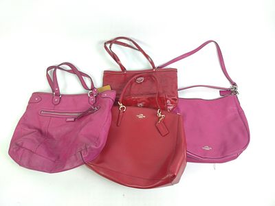 4 Coach Handbags. 13-1/2" to 14-1/4" wide. One with staining to bottom.