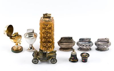 8 Table Top Lighters. Assorted tabletop lighters, including styles like a globe, Buick 1911 