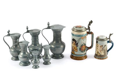 2 Steins and Pewter Jugs Set. Includes 6 pewter jugs/pitchers with an acorn-like finial on top 