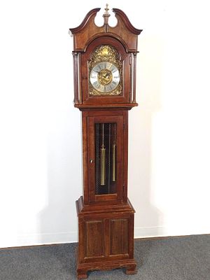 Tall Case Clock. 17-1/2" wide X 10-1/4" deep X 76" high. Case has some water damage.