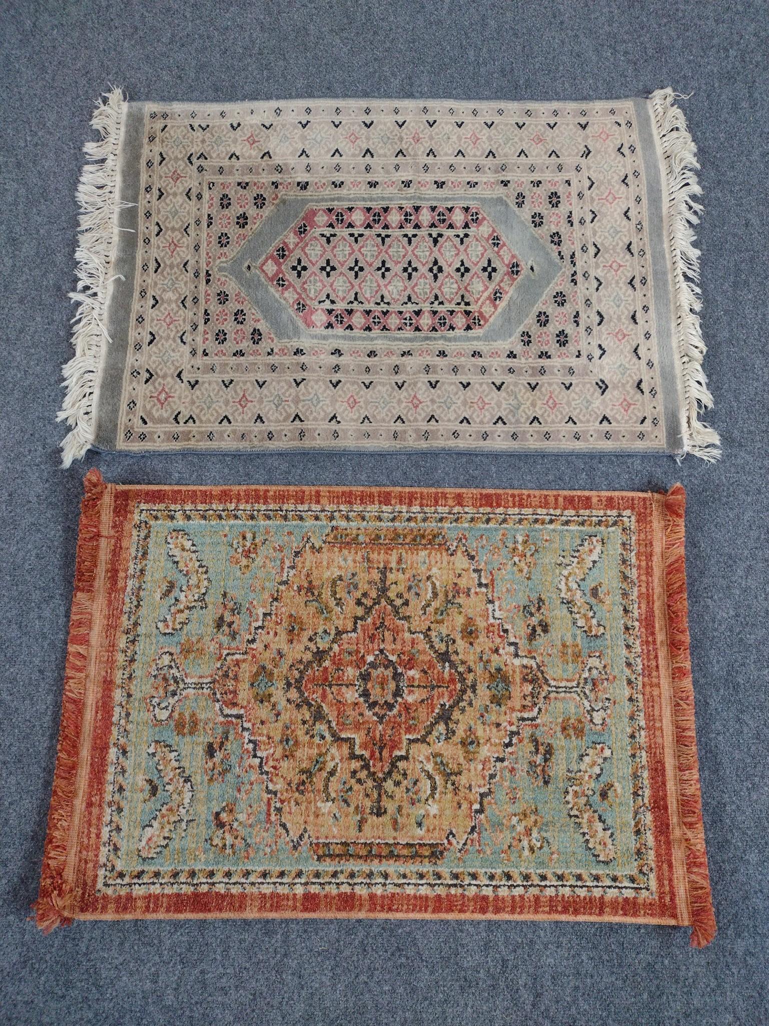 2 Throw Rugs