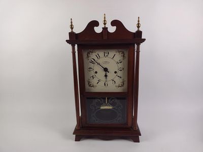 The New England Clock Co. Mantle Clock. Eight day spring wound. Untested. Measures 13" x 6" x 24".