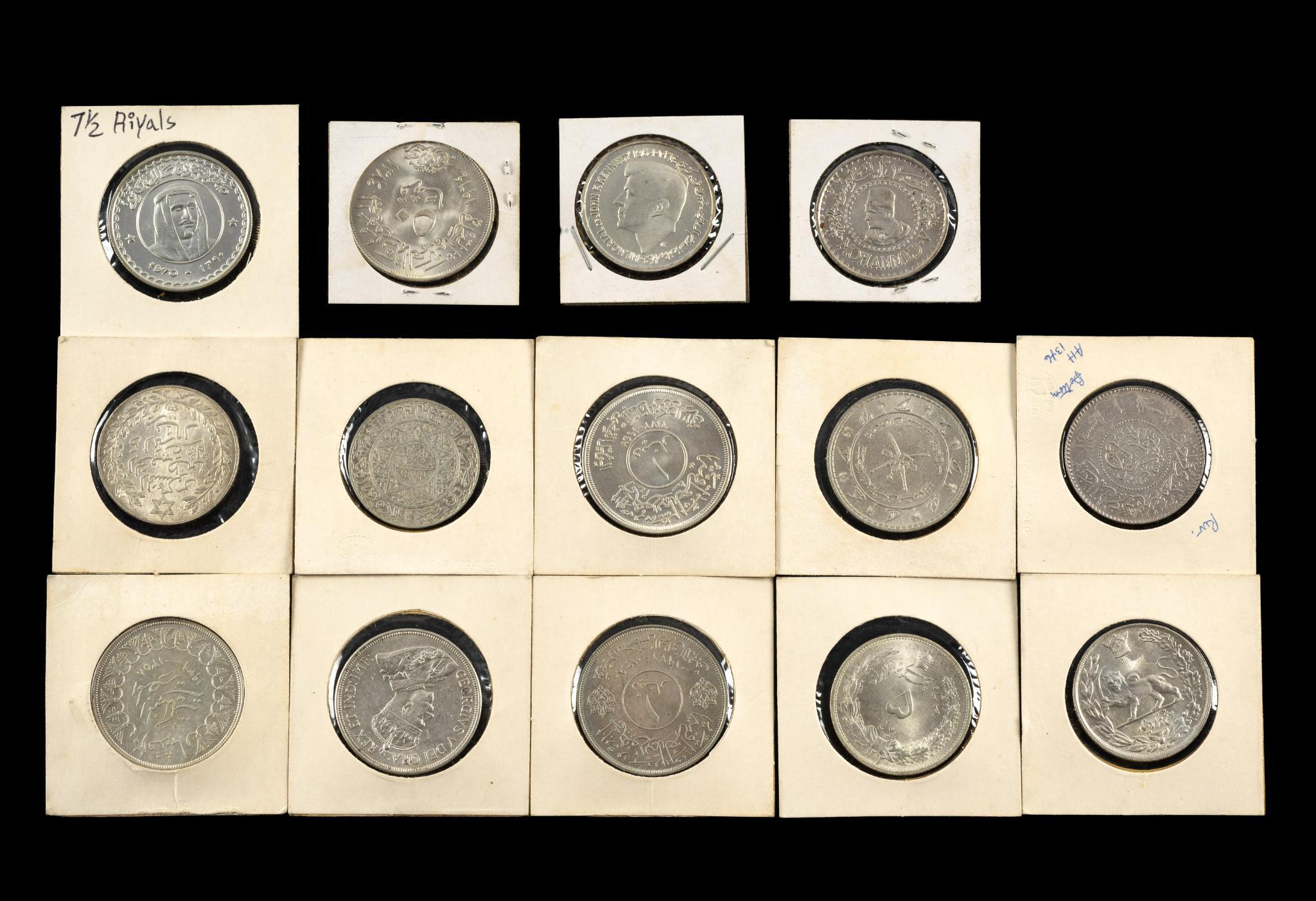 Fourteen Silver Middle Eastern Dollar Sized Coins