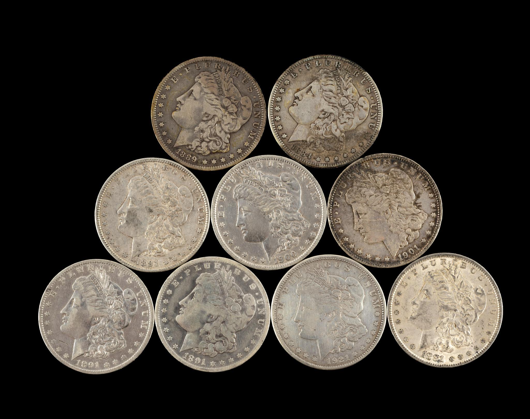 Nine Morgan Silver Dollars