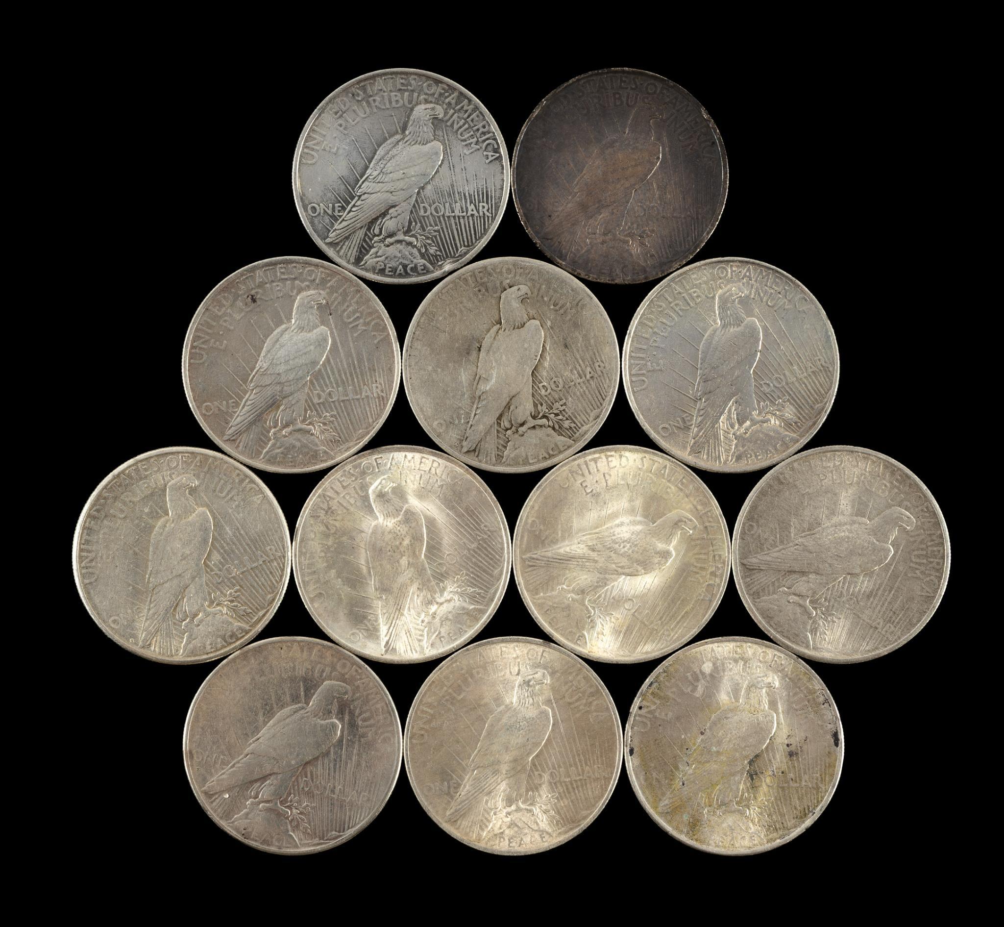 Twelve Peace Silver Dollars