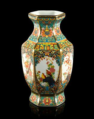 Chinese Famille Rose Hexagonal Vase. The vase is 9 3/4" in height and is marked Qianlong Yu Zhi 