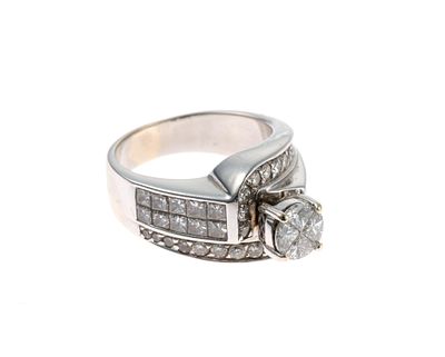 14K White Gold and Diamond Ring. A size 7 white gold ring with over 40 diamonds totaling 