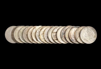 Eighteen Silver Morgan And Peace Dollars. Common dates with some better grades.