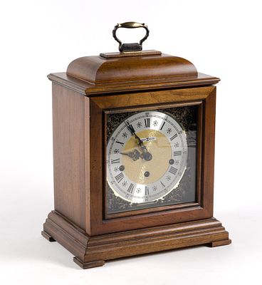 Howard Miller Mantle Clock. Measures 11" wide x 7" deep x 15-1/4" high. Comes with key, untested.