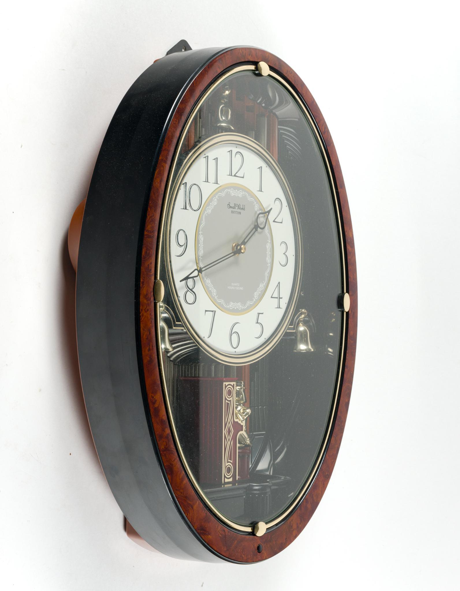 2 Wall Clocks Incl. Small World