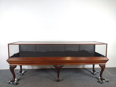 Large Carved Glass Top Display. 108" wide X 30-1/2" deep X 42-1/2" high. Front panel has crack 