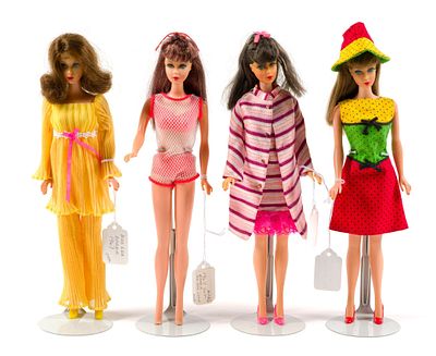 4 Modern Era Barbies. Tags describing the dolls and clothing as provided by consignor. Includes 