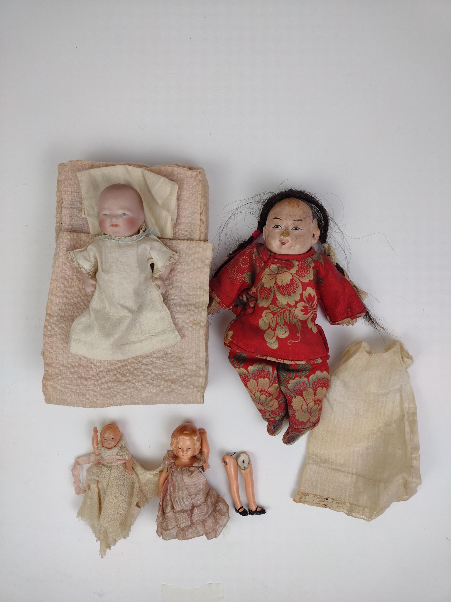 4 Miniature Dolls