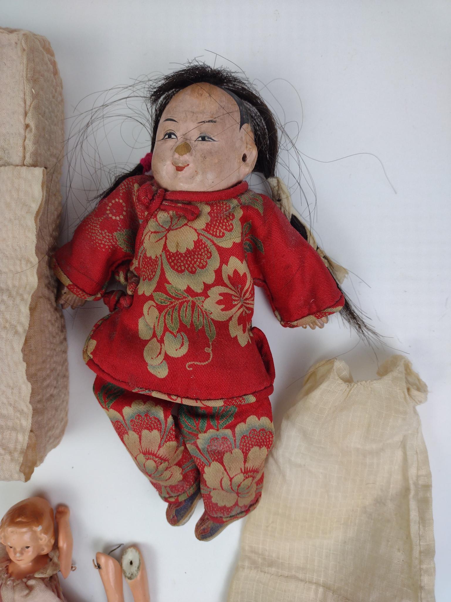 4 Miniature Dolls