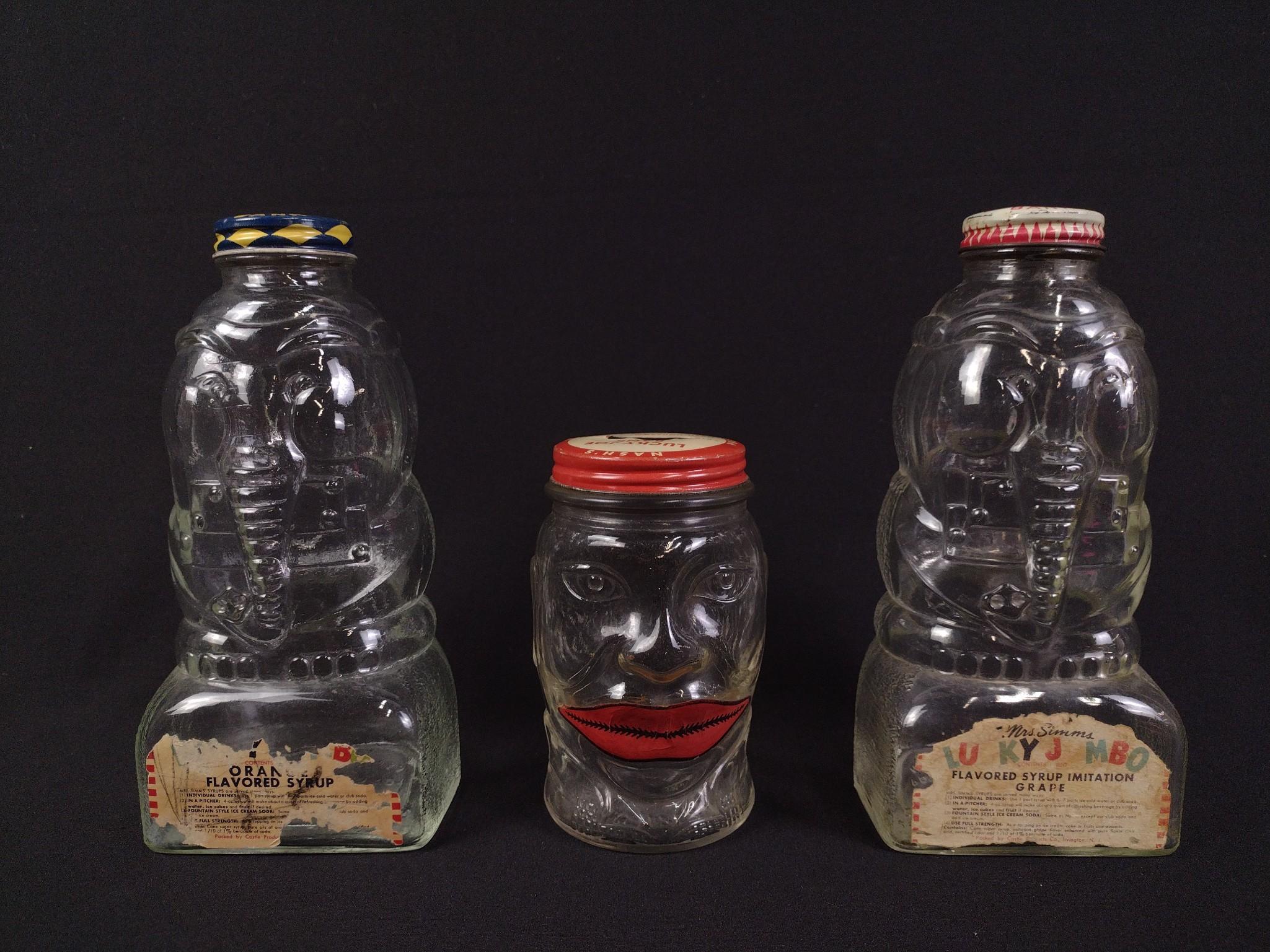 3 Antique Glass Bottle Banks
