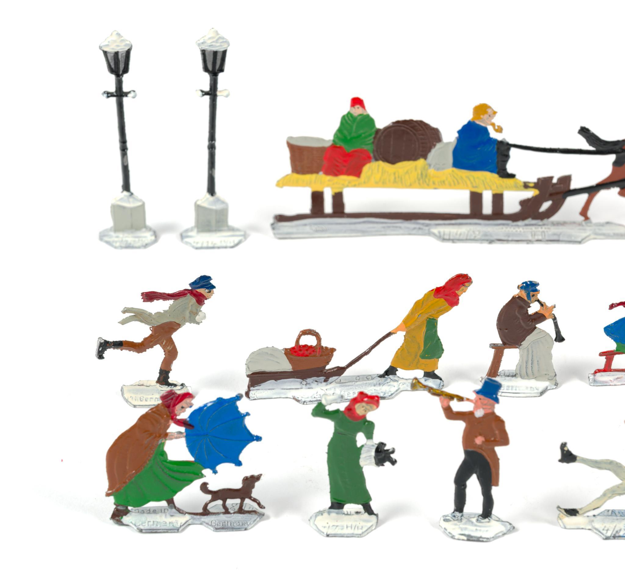 German Flat Metal Winter Skaters Figures