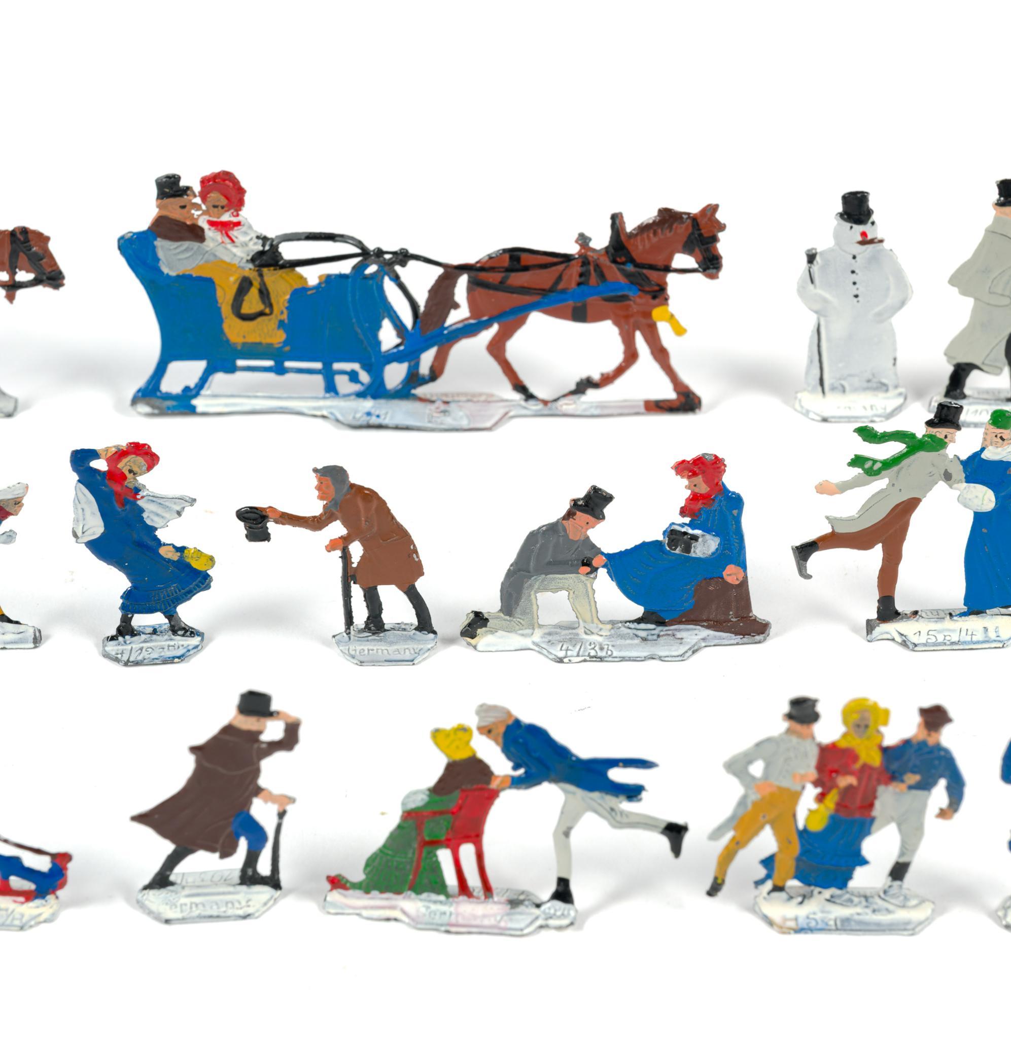 German Flat Metal Winter Skaters Figures