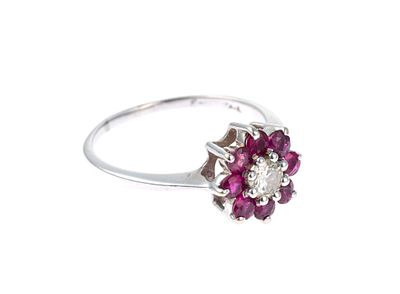 14K Gold Ruby and Diamond Ring. A size 8 white gold ring with eight rubies surrounding a 