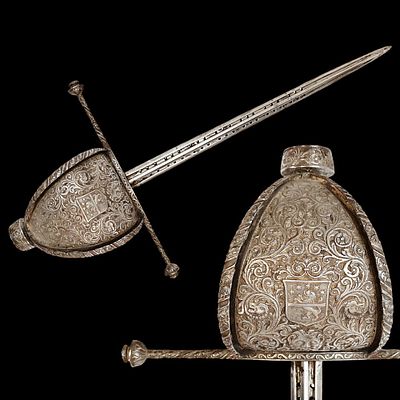 A beautiful Left-hand dagger with coat of arms, 17th century style, stamped by P. Giordano, 19th C.
