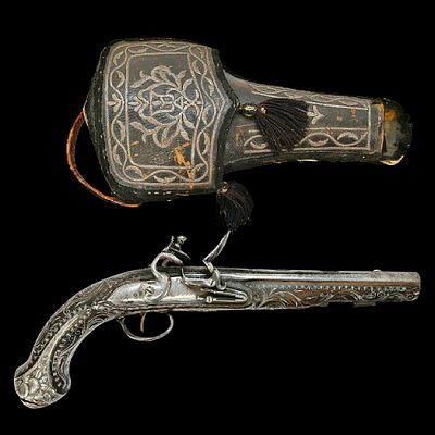 An Incredible Ottoman Silver-Mounted Flintlock Pistol with Embroidered Holster, Circa 1800. Item 