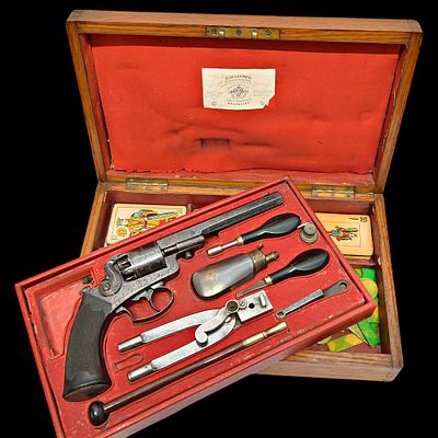 A Cased Belgian percussion Comblain's Revolver and Gaming Set by Henri Mangeot, mid-19th Century. 