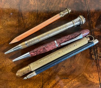 A selection of pencils, including one advertising pencil. A selection of pencils including a 