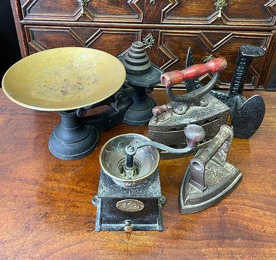 A collection of metal ware, including scales and coffee grinder