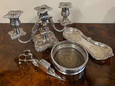 A Selection Of Silver Plate including a wine coaster, candle snuffer, candelabra and tray