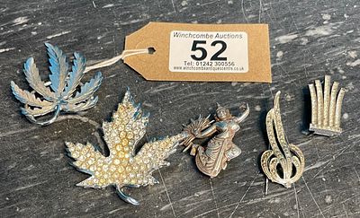 A Collection Of Five Brooches including some silver