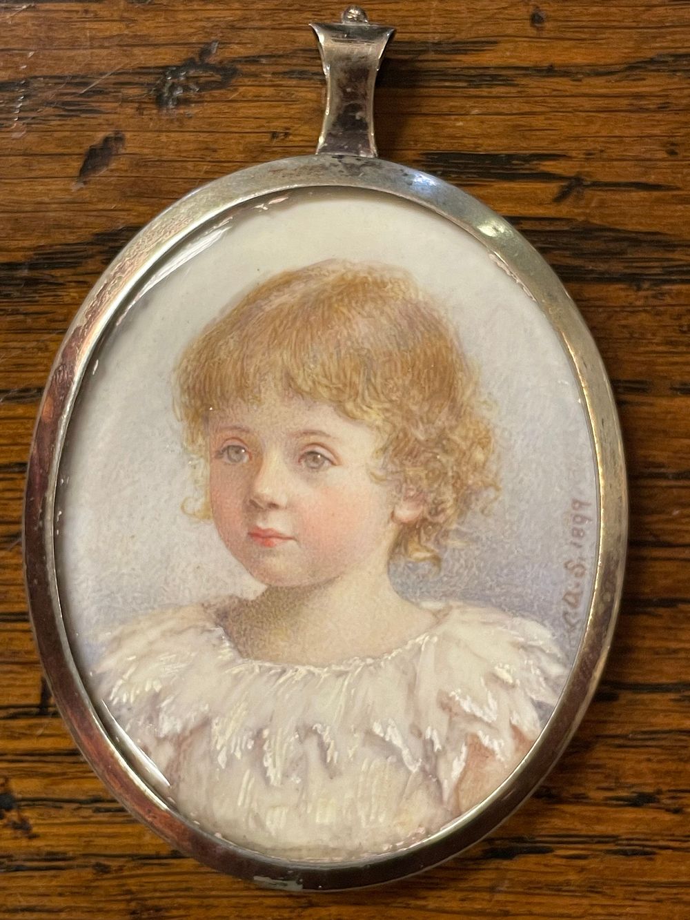 Lot 333 – A Late Victorian Portrait Miniature and Hairwork Memento Locket, dated 1899