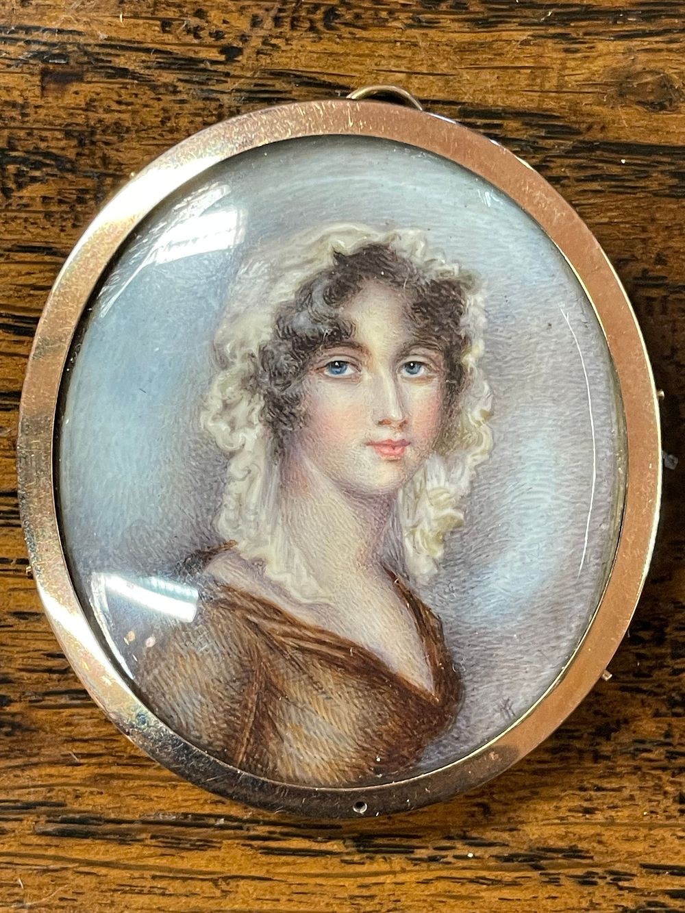Lot 338 – A Georgian Portrait Miniature and Hairwork Memento Mori Locket